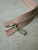 Молния неразъёмная бежево-коричневая длина 20 см, звено Т6 металл цвет серебро МКБ/20/60058 по цене 383 руб./штука